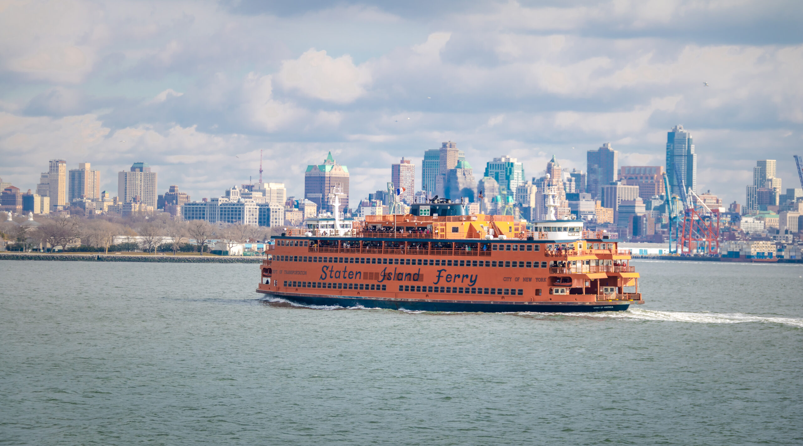 Staten Island Ferry and Lower Manhattan Skyline - New York, USA
